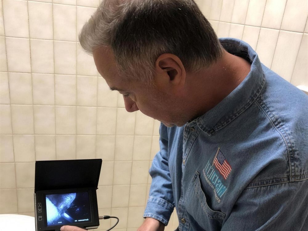 TechClean specialist running a borescope inspection