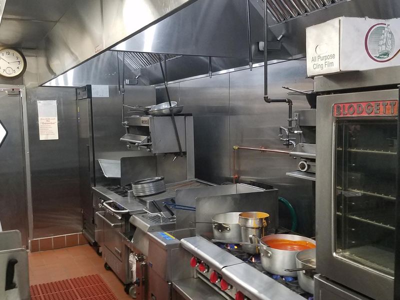 Commercial kitchen with exhaust hood