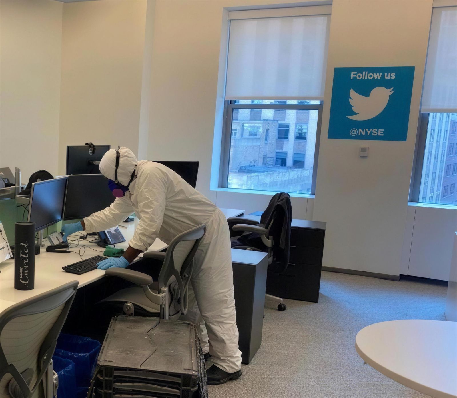 Disinfection crew in protective suits in a New York Stock Exchange office
